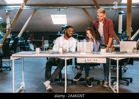 Deadline concept. Creative team working late at night Stock Photo