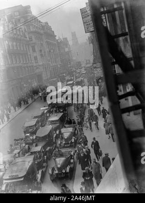 4th May 1926. Fleet Street, London, England. The streets of London busy with pedestrians and motor vehicles, as the general Strike begins to take hold. Soon, the streets would see the British Army in tanks and armoured cars, in an attempt to keep the peace and maintain basic services. Stock Photo