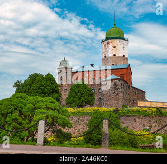 Architecture of old town Vyborg, Russia, Europe. Saint Olaf tower and Vyborg castle on summer day. Stock Photo