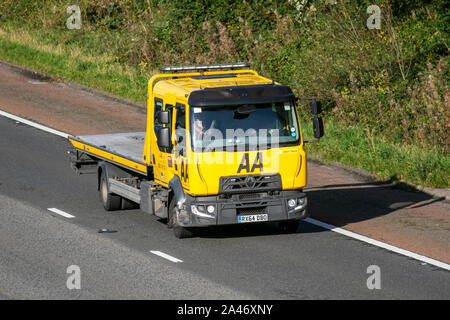 2014 Renault Trucks D AA Van recovery truck. Side view of rescue breakdown recovery lorry truck transporter driving along  M6 motorway,  Lancaster, UK; Vehicular traffic, transport, modern, north-bound on the 3 lane highway. Stock Photo