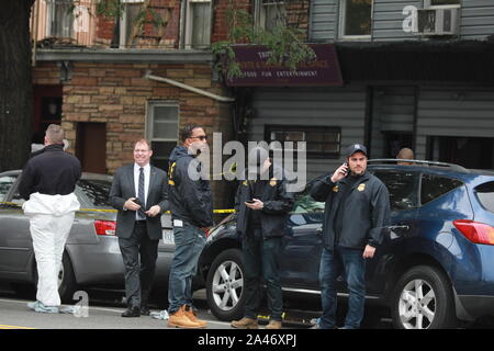 New York, USA. 12th Oct, 2019. Police investigate the scene of a shooting in New York, the United States, on Oct. 12, 2019. Four people were killed and three others injured in a shooting in New York's Brooklyn borough on early Saturday, according to the police. Credit: Zhang Mocheng/Xinhua/Alamy Live News Stock Photo