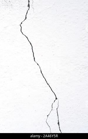 Crack on a white wall Stock Photo