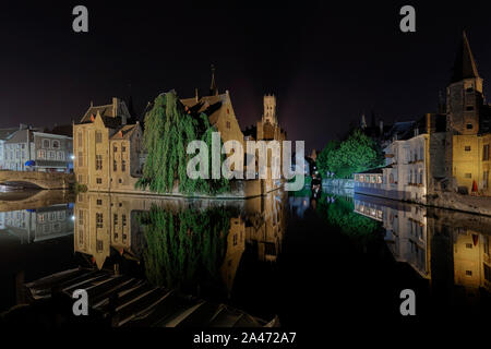 BRUGES, BELGIUM - AUGUST 2019; The Dijver Canal At Night Stock Photo