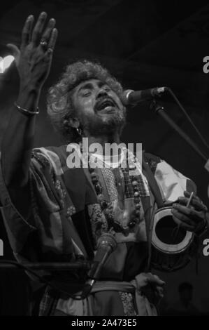 Paban Das Baul performs on a stage. He is known for pioneering traditional Baul music on the international music scene and for establishing a genre of Stock Photo