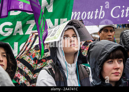 London, UK. 12th October 2019. Trade unionists hold a rally in Trafalgar Square in the rain to show their solidarity with Extinction Rebellion and the school climate strikers. They recognise that the Climate and Ecological Emergency means that the very future of life on this planet is at stake and we need to take radical action without delay to avoid catastrophe. After the rally they were to march to join the main Extinction Rebellion March in Grief. Peter Marshall/Alamy Live News Stock Photo