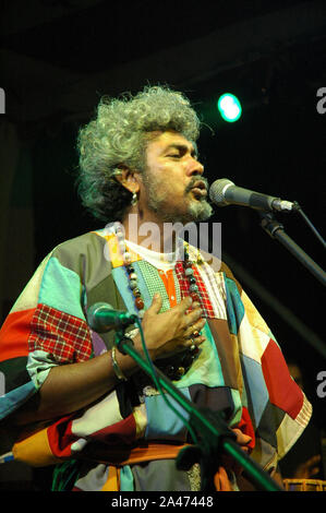 Paban Das Baul performs on a stage. He is known for pioneering traditional Baul music on the international music scene and for establishing a genre of Stock Photo