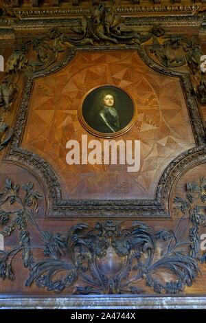 Fireplace decoration with portrait of the 1st Duke of Devonshire - Great Chamber, Chatsworth House - Derbyshire, England - Stock Photo