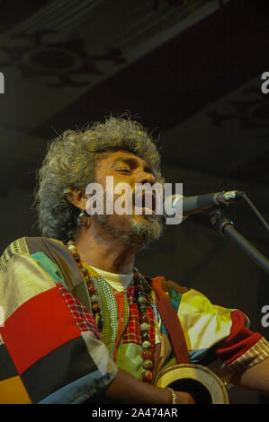 Paban Das Baul performs on a stage. He is known for pioneering traditional Baul music on the international music scene and for establishing a genre of Stock Photo