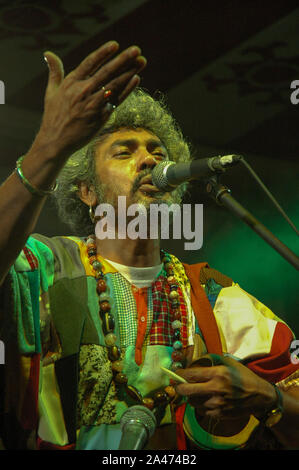 Paban Das Baul performs on a stage. He is known for pioneering traditional Baul music on the international music scene and for establishing a genre of Stock Photo