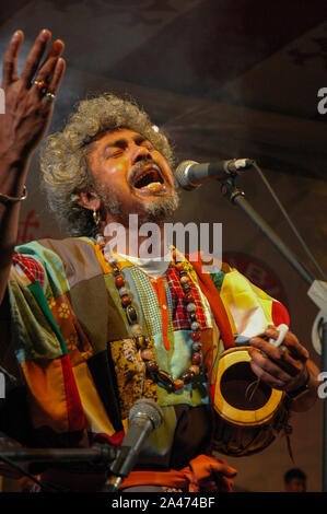 Paban Das Baul performs on a stage. He is known for pioneering traditional Baul music on the international music scene and for establishing a genre of Stock Photo