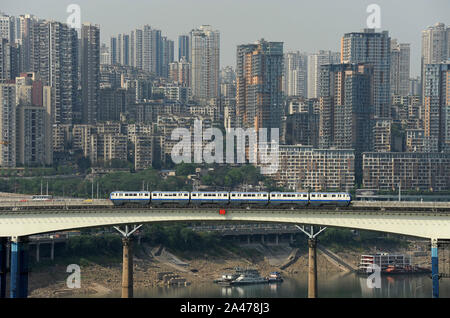 Monorail train crosses the Jialing river on Chongqing metro line 3, China Stock Photo