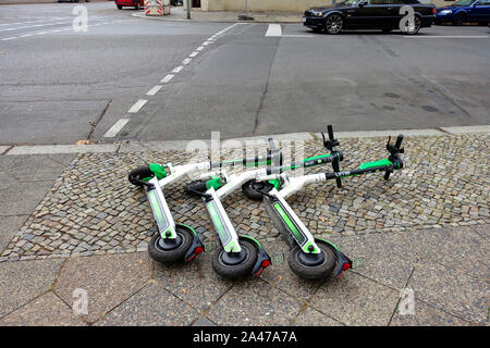 E-scooters of Lime in Berlin Stock Photo
