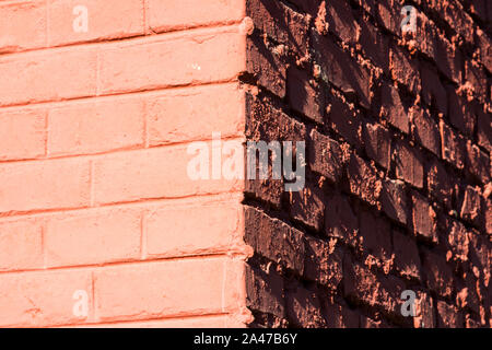 Red painted brick wall corner texture Stock Photo