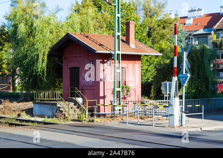 GYSEV 54 signal box built ca 1900 beside railway level crossing, Batsanyi utca, Sopron, Hungary Stock Photo