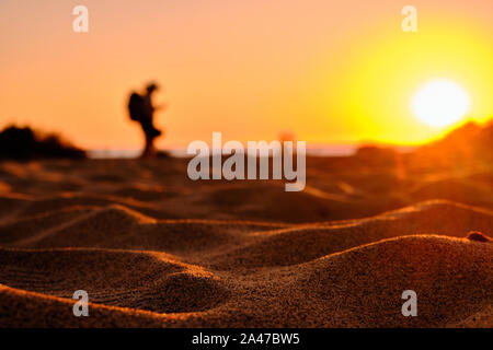 Explorer in Piscinas desert during twilight, Arbus, Sardinia, Italy Stock Photo