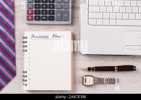 Watch, pen and notebook. Stock Photo