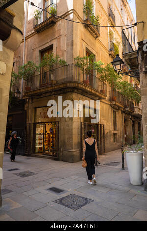 Exploring the Narrow Alley Ways in the Gothic Quarter in Spain Stock Photo