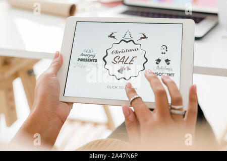 Hands of female customer over touchpad display going to enter online shop Stock Photo