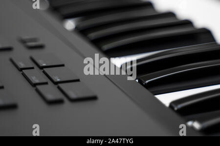Professional midi keyboard synthesizer with knobs and controllers. Stock Photo