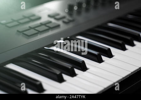 Professional midi keyboard synthesizer with knobs and controllers. Stock Photo