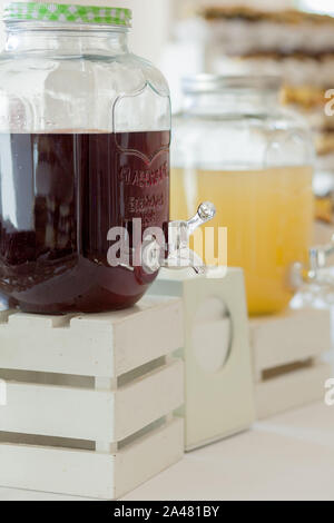 Glass jars of lemonade on wedding candy bar. Catering. Drinks on wedding party. Stock Photo