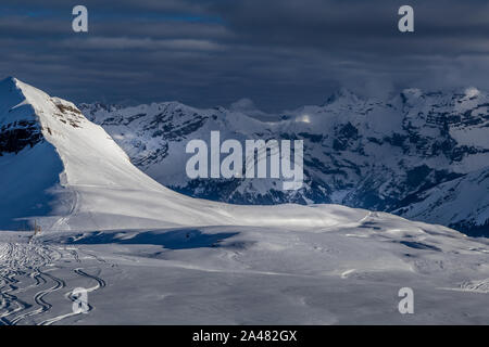 Free ski terrain, Alps in Flaine area, Grand Massif, France Painting skiers in powder snow Stock Photo
