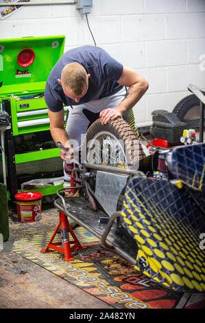 Manchester, UK. 11 October 2019.  Mechanic working on the sidecar unit during the ACU Sidecar Speedway Manchester Masters, Belle Vue National Speedway Stadium, Manchester Friday 11 October 2019 (Credit: Ian Charles | MI News) Credit: MI News & Sport /Alamy Live News Stock Photo