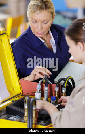 female mechanic in electronics training course Stock Photo