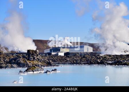 Svartsengi, Iceland. Just beyond the waters of the Blue Lagoon steam and smoke bellow from the Svartsengi Geothermal Power Station. Stock Photo