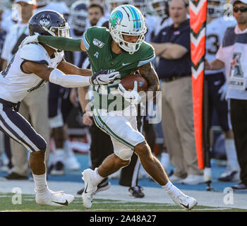 October 12, 2019: Tulane's Jacob Robertson Jr. #15 tries to shake off a UConn defender during the NCAA football game between the Tulane Green Waver and the UConn Huskies at Yulman Stadium in New Orleans, LA. Kyle Okita/CSM Stock Photo