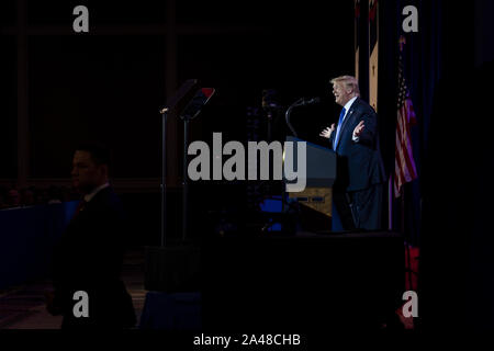 Washington DC, USA. 12th Oct, 2019. President Donald Trump delivers remarks at Values Voter Summit at the Omni Shoreham Hotel on October 12, 2019 in Washington, DC. The appearance at the Summit comes as evangelical leaders this week criticized Trump's decision to stand down US forces in northern Syria. Photo by Pete Marovich/UPI Credit: UPI/Alamy Live News Stock Photo