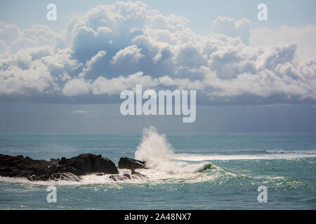 Surreal looking Cumulonimbus storm Clouds over the ocean with waves ...