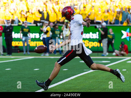 Waco, Texas, USA. 12th Oct, 2019. Texas Tech Red Raiders place kicker Austin McNamara (31) punts the ball during the 2nd half of the NCAA Football game between Texas Tech Red Raiders and the Baylor Bears at McLane Stadium in Waco, Texas. Matthew Lynch/CSM/Alamy Live News Stock Photo