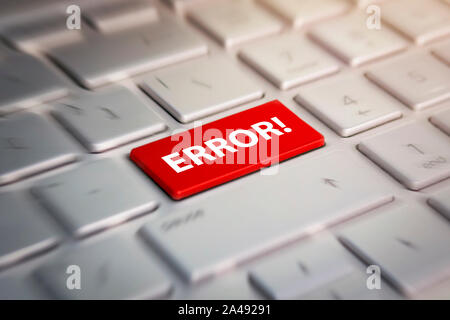 error button on computer keyboard showing internet concept. Red button on the keyboard close-up. blurred in motion background. Stock Photo