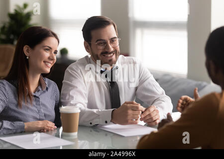 Happy hr managers holding job interview with successful work candidate. Stock Photo