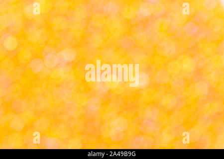 Yellow and orange bokeh on the orange background. Stock Photo