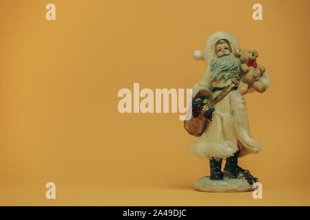 Christmas and New year background with empty dark wooden deck table over Christmas tree and blurred light bokeh. Empty display for product montage. Ru Stock Photo