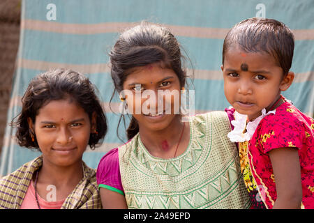 CHANDANPUR, INDIA, JANUARY 14, 2019 : Portrait of young Indian sisters in a rural street Stock Photo