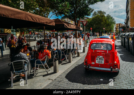 Madrid, Spain - Oct 13, 2019: People enjoying drinks and conversation at an outdoor terrace in the historic centre of Madrid during the summer Stock Photo