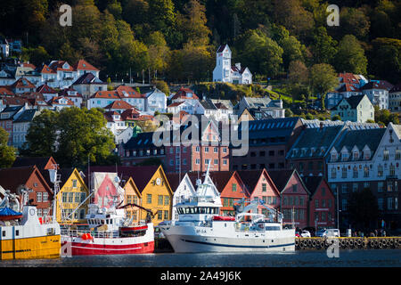 Houses on a hillside and boats in the harbour Bergen, Norway Stock Photo