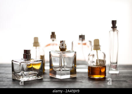 Perfume bottles on wooden background Stock Photo