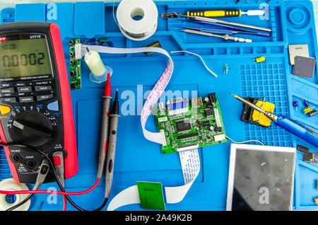 The electrician's workplace. Electronics. Schemes soldering iron. multimeter Stock Photo