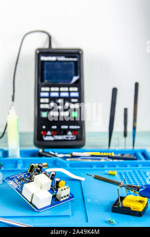 The electrician's workplace. Electronics. Schemes soldering iron. oscilloscope Stock Photo