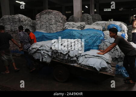 saver tannery workers Dhaka,Bangladesh 2019: Bangladeshi tannery workers process raw leather inside a factory at the Saver tannery area in Dhaka, Bang Stock Photo