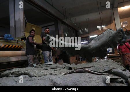 saver tannery workers Dhaka,Bangladesh 2019: Bangladeshi tannery workers process raw leather inside a factory at the Saver tannery area in Dhaka, Bang Stock Photo