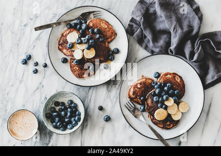 Breakfast banana pancakes with blueberry, honey and coffee Stock Photo