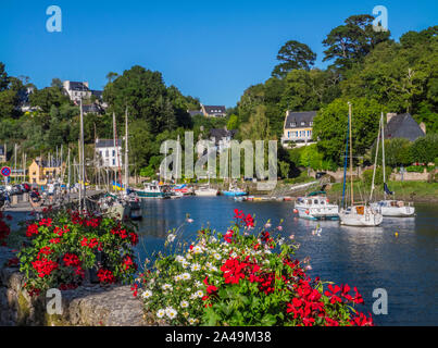 Pont-Aven Brittany floral sunny landscape scene with sailing boats and houses on the banks of the River Aven Finistère department of Brittany France Stock Photo