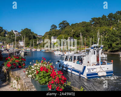 Pont-Aven Brittany scene with Port Belon Ferry boat & sailing boats and houses on the banks of the River Aven Finistère department of Brittany France Stock Photo