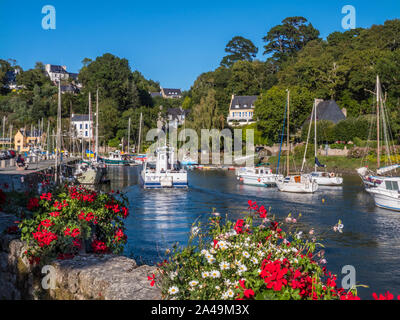 Pont-Aven Brittany scene with Port Belon Ferry boat & sailing boats and houses on the banks of the River Aven Finistère department of Brittany France Stock Photo