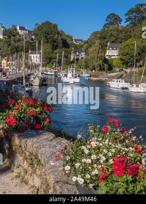 Pont-Aven Brittany vista with Port Belon Ferry boat & sailing boats and houses on the banks of the River Aven Finistère department of Brittany France Stock Photo